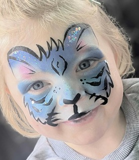 Girl with tiger face paint in Telford